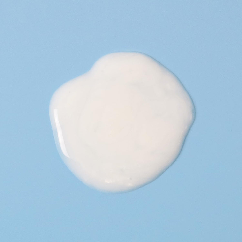 Bottle-side view of Amazon Basics Moisturizing Body Wash showcases nourishing blend with coconut oil and shea butter
