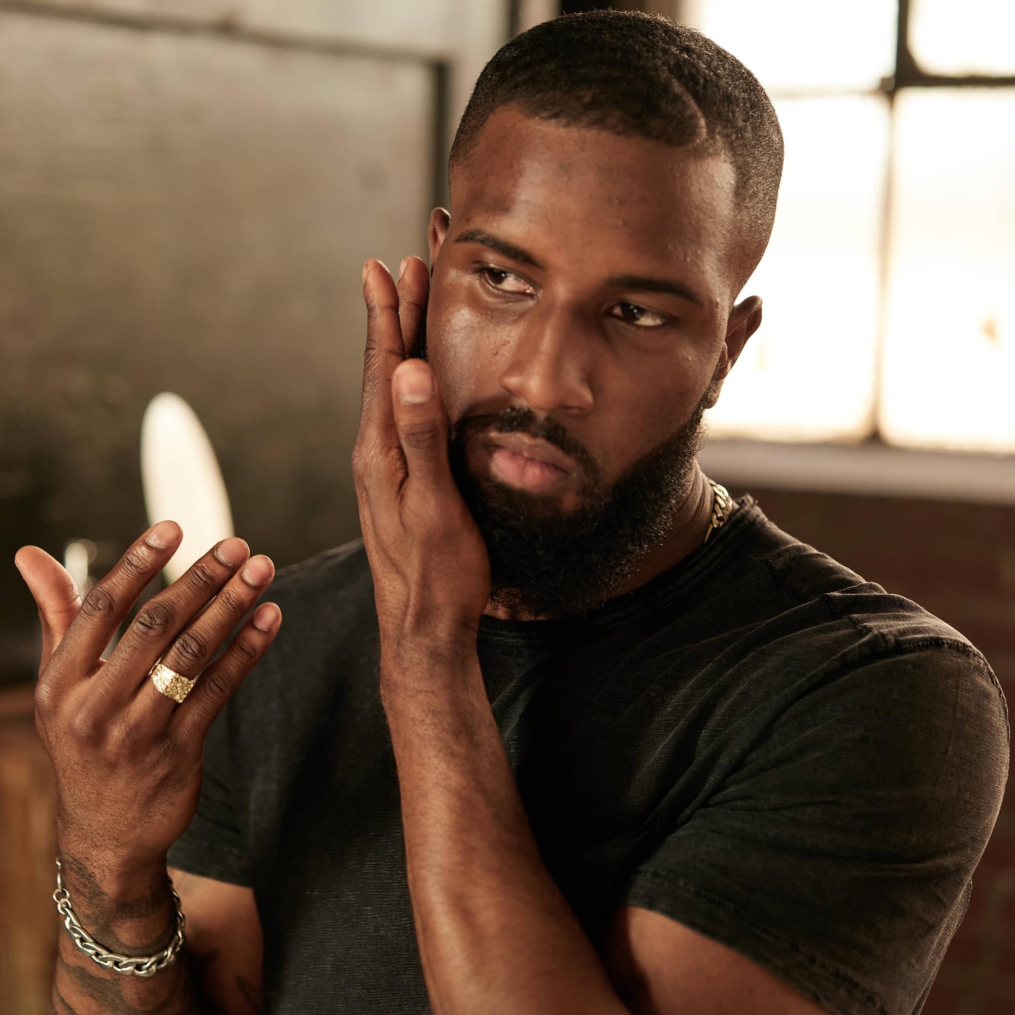American Crew Beard Conditioner Serum hands-application illustrates lightweight formula on facial hair