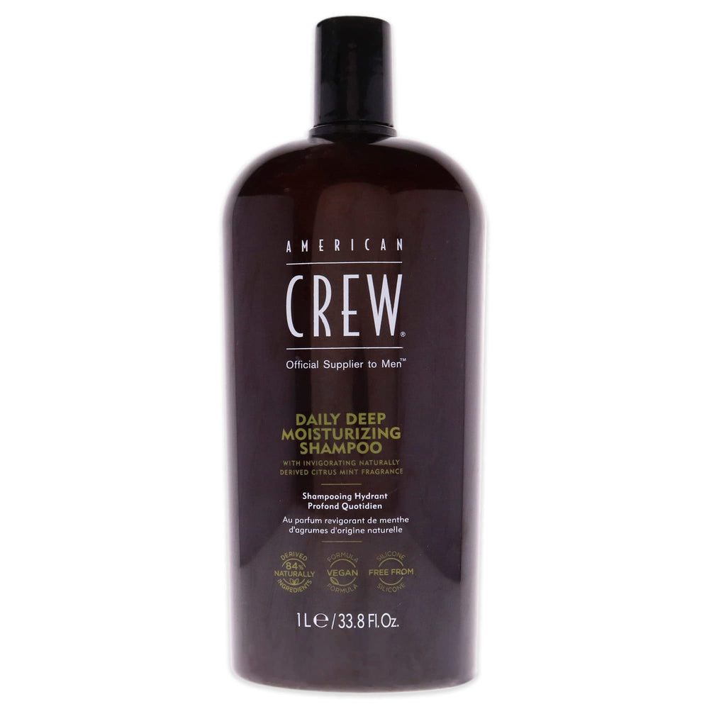 American Crew Daily Moisturizing Shampoo bottle pour demonstrates quick, refreshing wash.