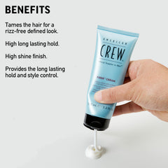 Hands applying American Crew Fiber Cream to damp hair for textured control.