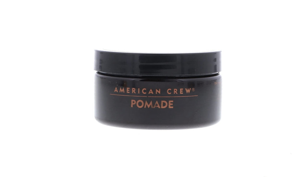 American Crew Pomade 3oz jar – hair application close-up, smooths for slick-back looks.