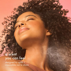 amika aura bottle close-up emphasizes sandalwood for a soft, grounding base