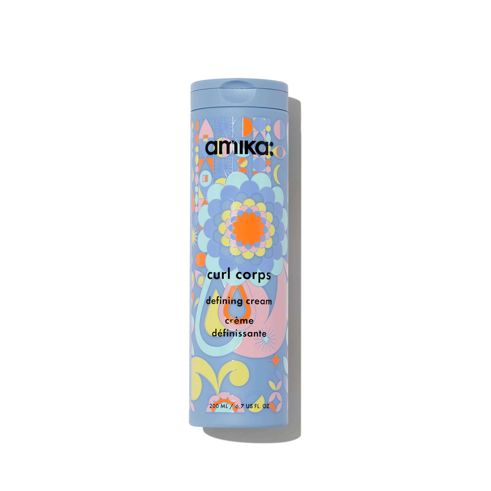 Amika Curl Corps Defining Cream bottle demonstrates smooth frizz control for defined curls.