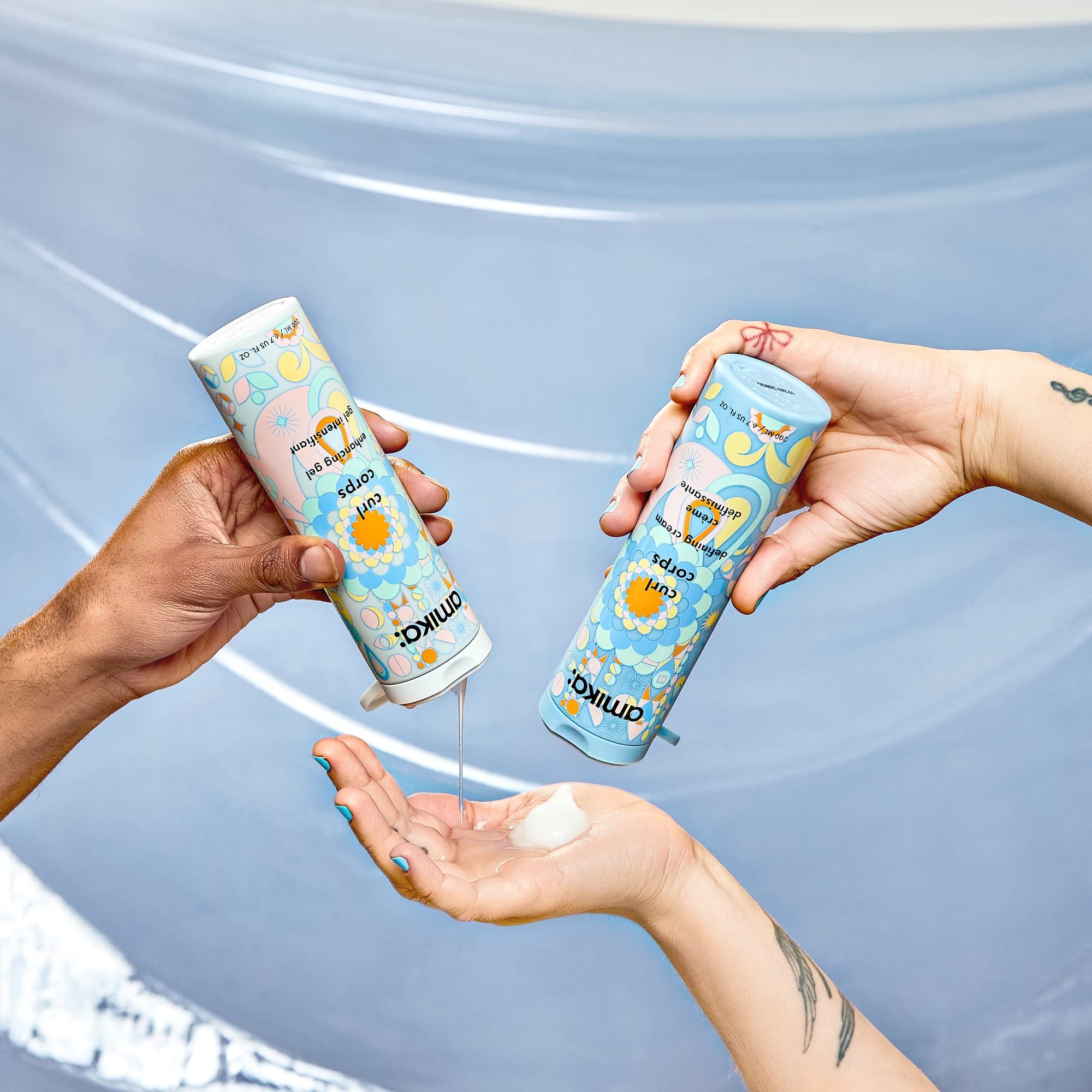 Shiny, moisturized curls after application emphasize touchable softness.