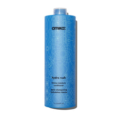 Amika Hydro Rush conditioner bottle delivering deep hydration for dry, textured hair.