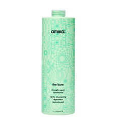 Amika Kure Strength Repair Conditioner bottle pour demonstrates hydration and detangling support