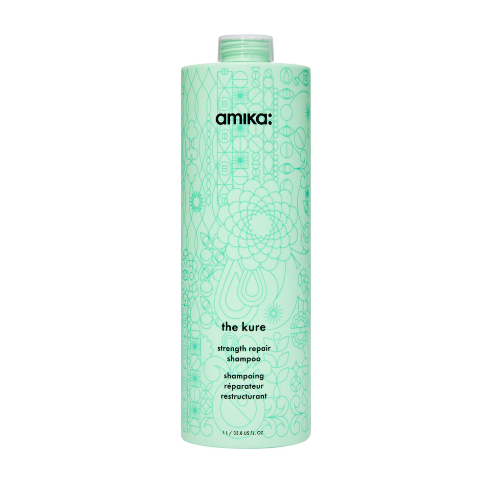Amika The Kure Strength Repair Shampoo bottle close-up highlighting bond fortifying formula for stronger hair