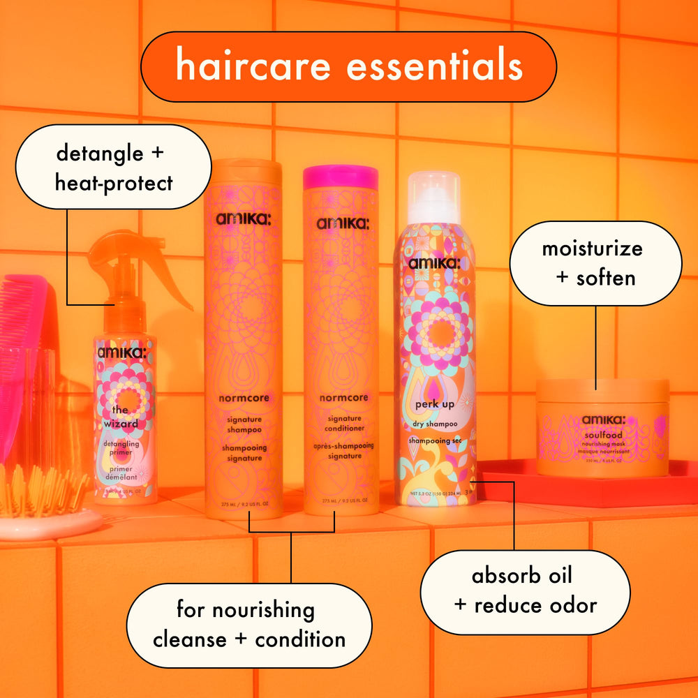 Amika Normcore Signature Shampoo product shot emphasizes the sulfate-free formula