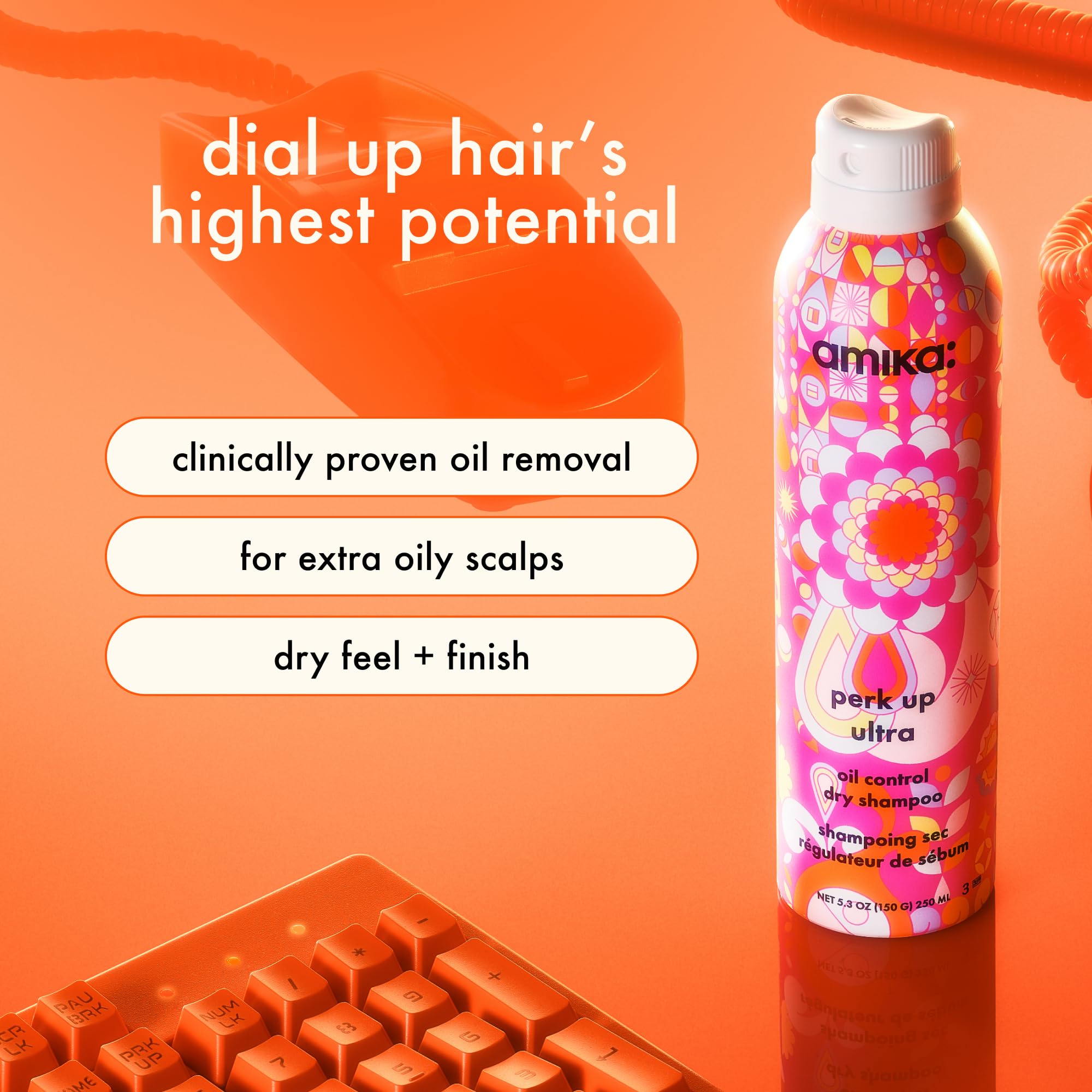 Amika Perk Up Ultra Dry Shampoo applied to roots for oil absorption.