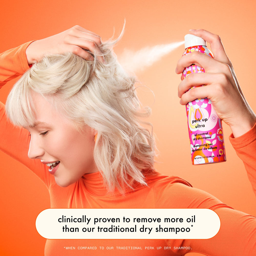 Amika Perk Up Ultra Dry Shampoo at the roots, absorbing oil after workouts.