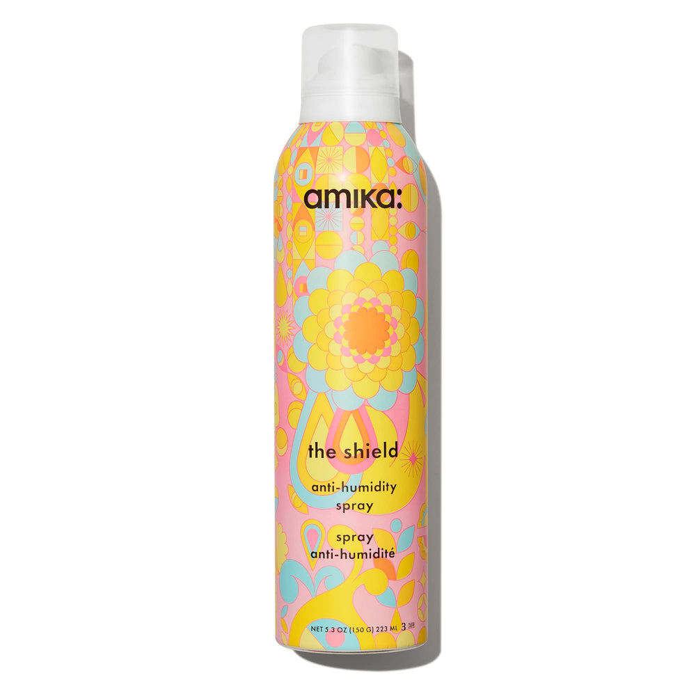 Amika Shield bottle front shows lightweight humidity protection for all-day smoothness.