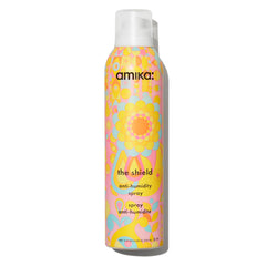 Amika Shield bottle front shows lightweight humidity protection for all-day smoothness.