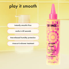 Amika Smooth Over Frizz-Fighting Treatment Mask being applied to damp hair for smoothing.