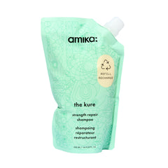 Amika The Kure Strength Repair Shampoo bottle close-up highlighting premium packaging and cleansing power