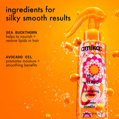 Amika The Wizard Detangling Hair Primer on the hair during application.