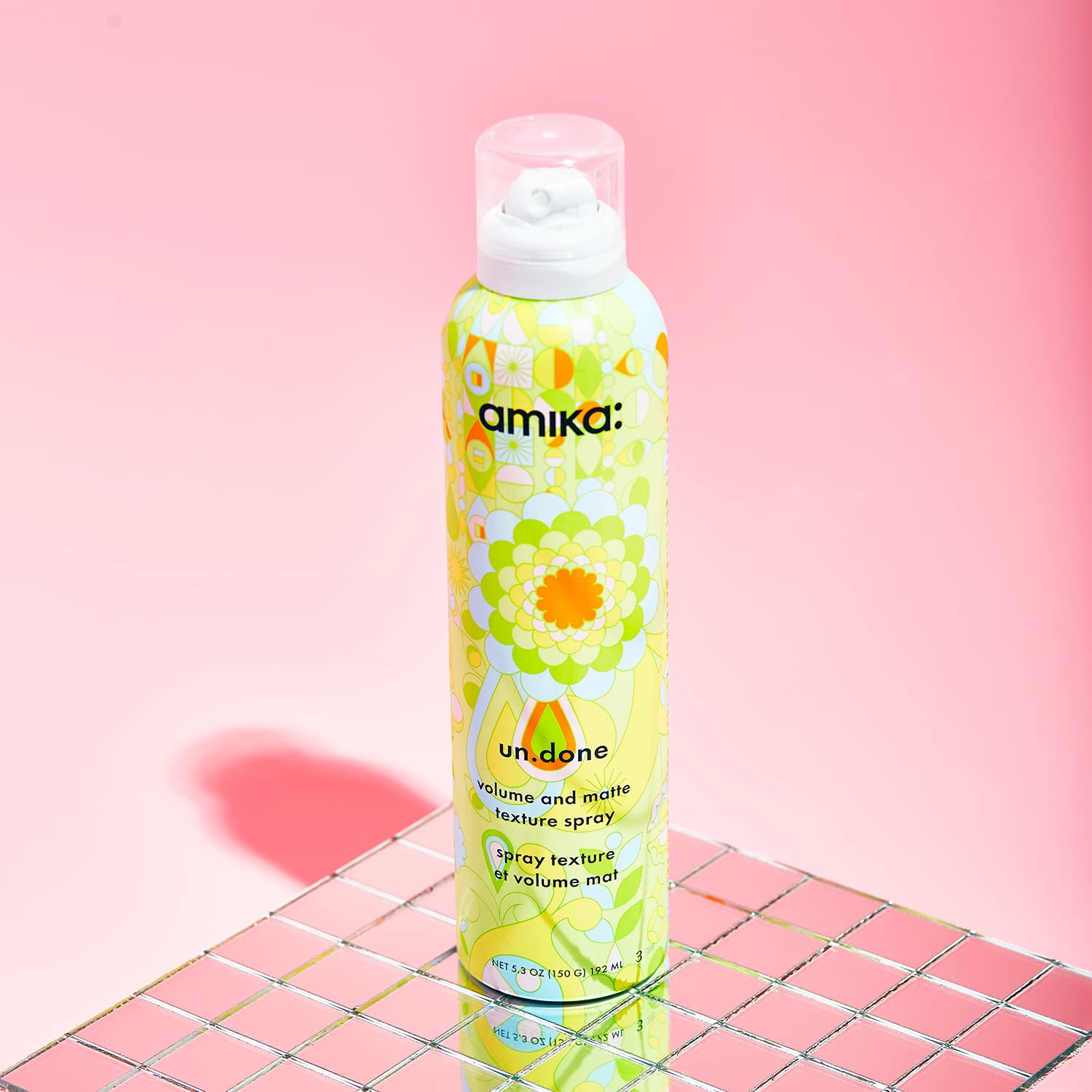 amika Un.Done zeolite ingredient emphasis indicating frizz control and long-lasting texture