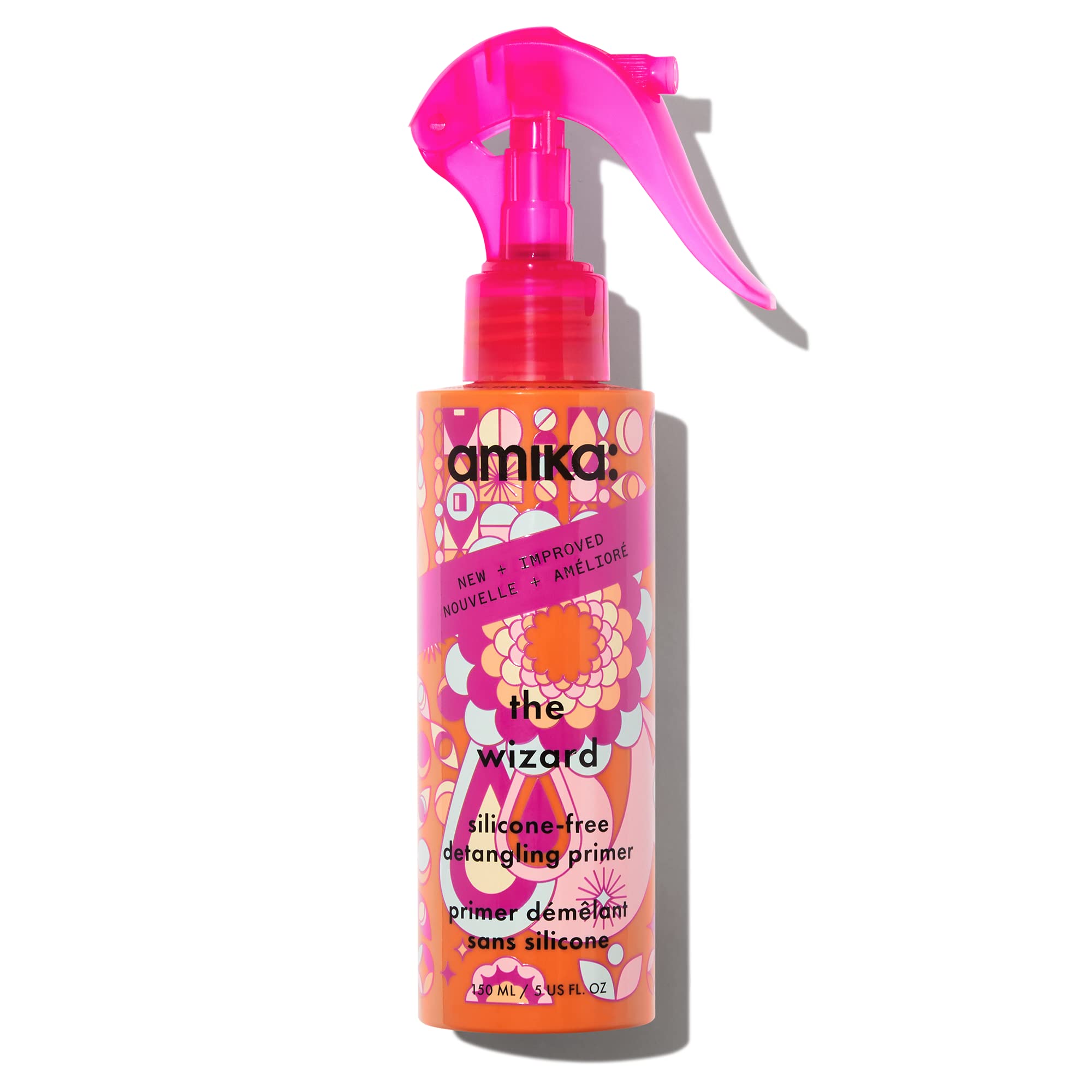 Amika Wizard silicone-free detangler bottle eases knots for effortless detangling.