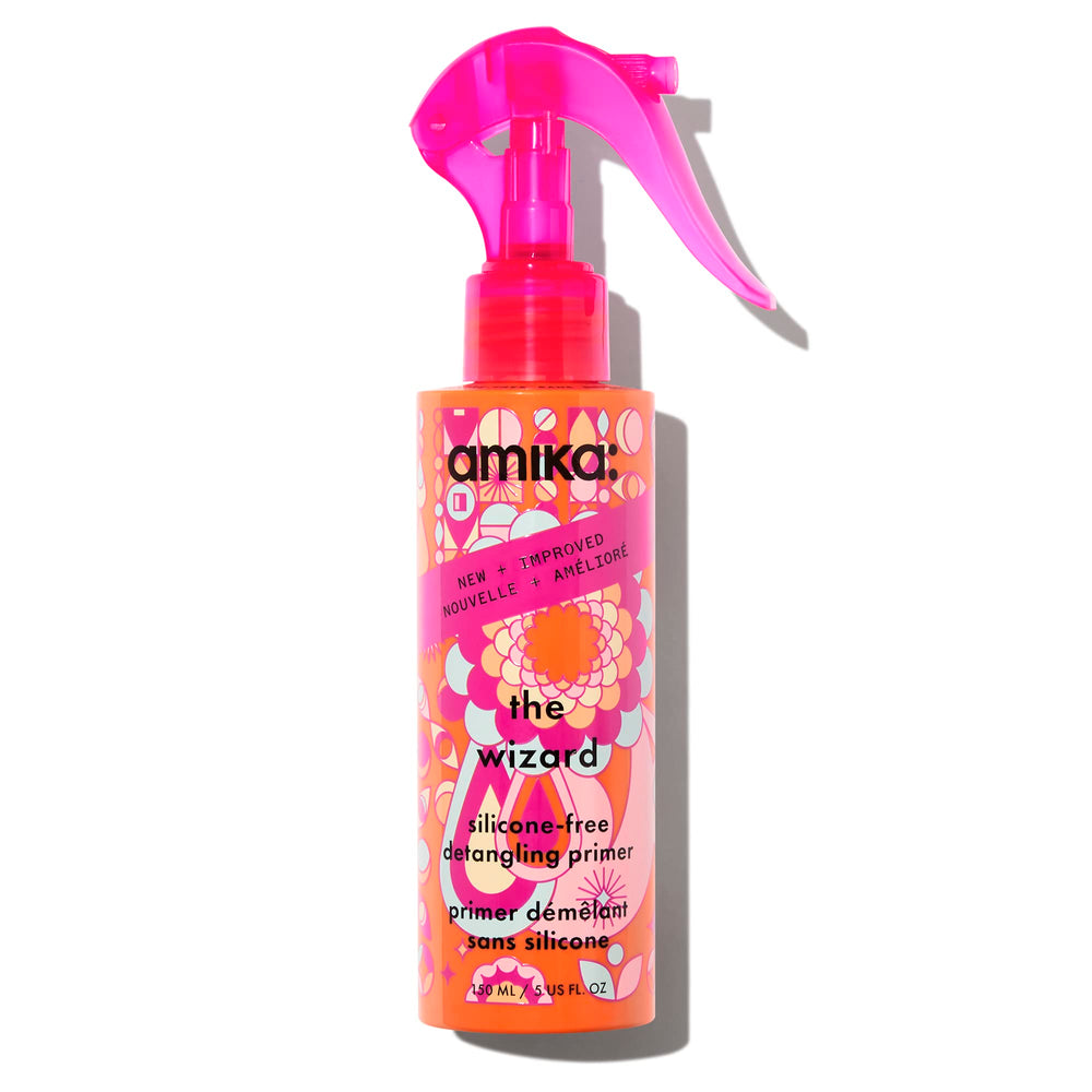 Amika Wizard silicone-free detangler bottle eases knots for effortless detangling.