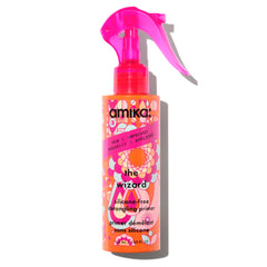Amika Wizard silicone-free detangler bottle eases knots for effortless detangling.