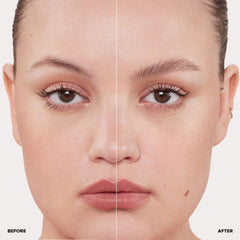 Anastasia Beverly Hills Clear Brow Gel applicator brush applying clear gel to control brow hairs.