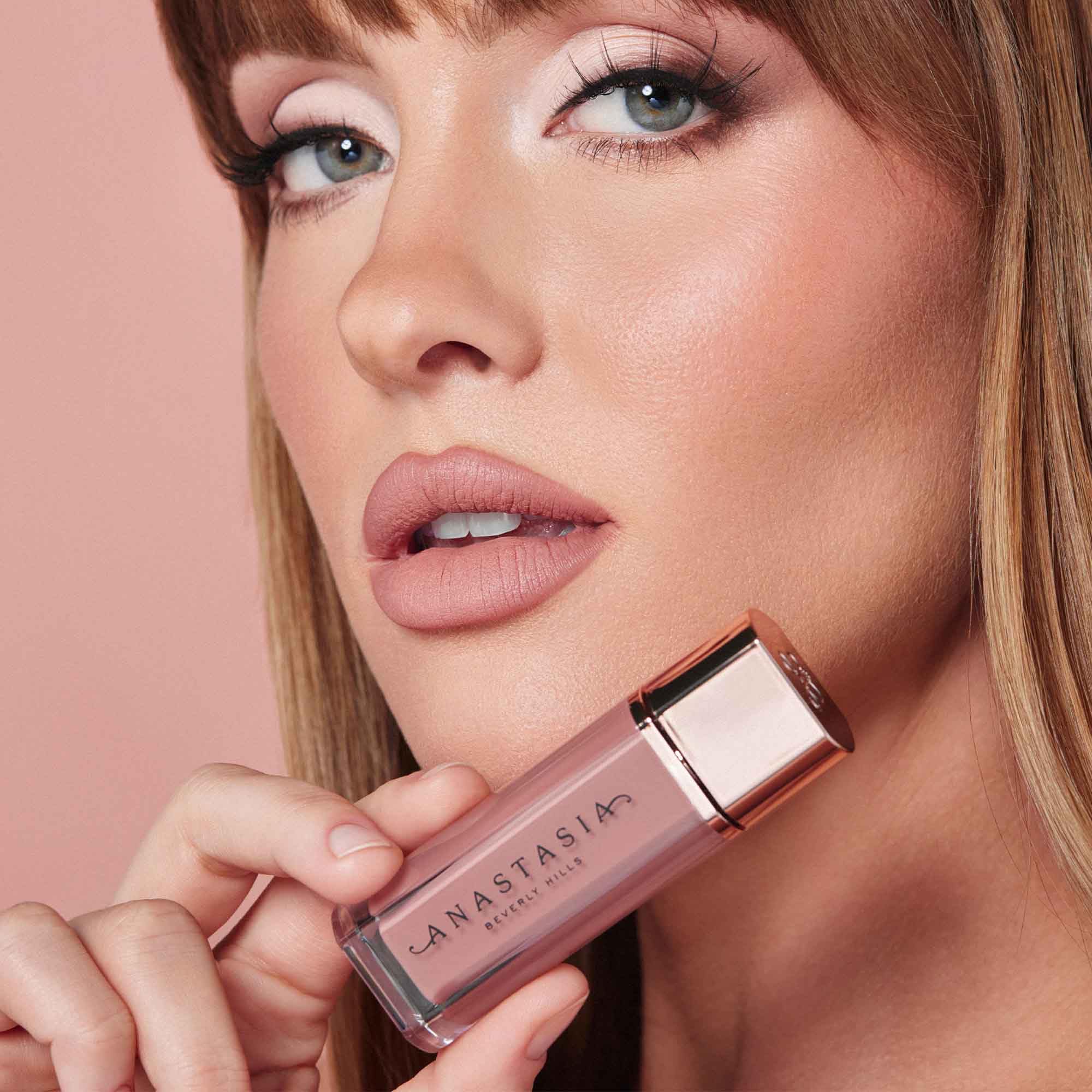 Anastasia Beverly Hills Lip Velvet Pure Hollywood applying scene emphasizes cushioned comfort.