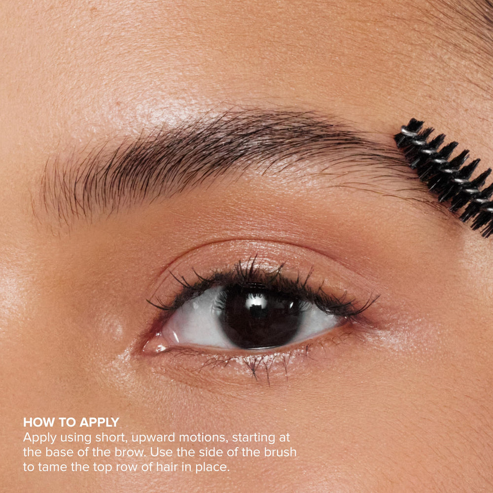 Anastasia Clear Brow Gel close-up on the brow hairs and brush.