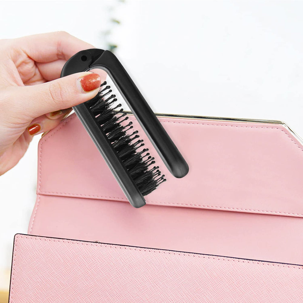 Ancable folding brush tucked into pocket or purse for travel