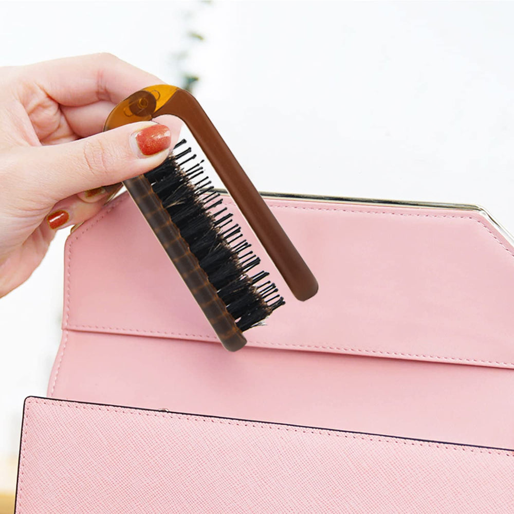 Ancable travel-friendly folding brush in a compact pouch-ready design.