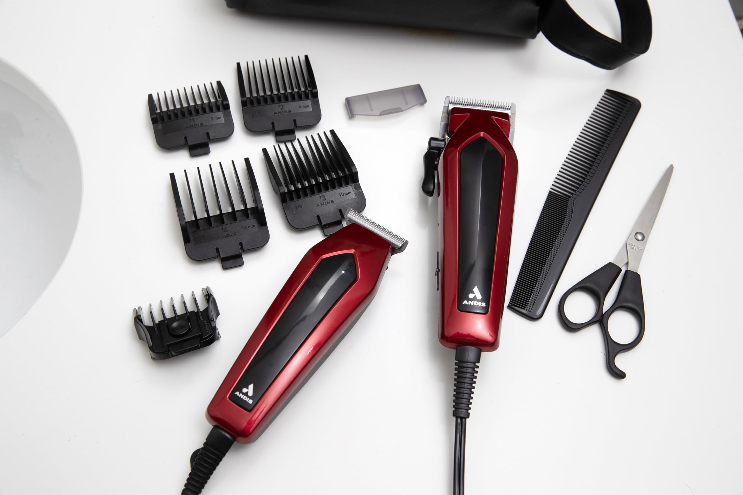 Andis clipper guards (#1–#4) arranged for versatile length control.