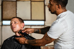 Andis reSURGE shaver in wet/dry use mode for convenient grooming.