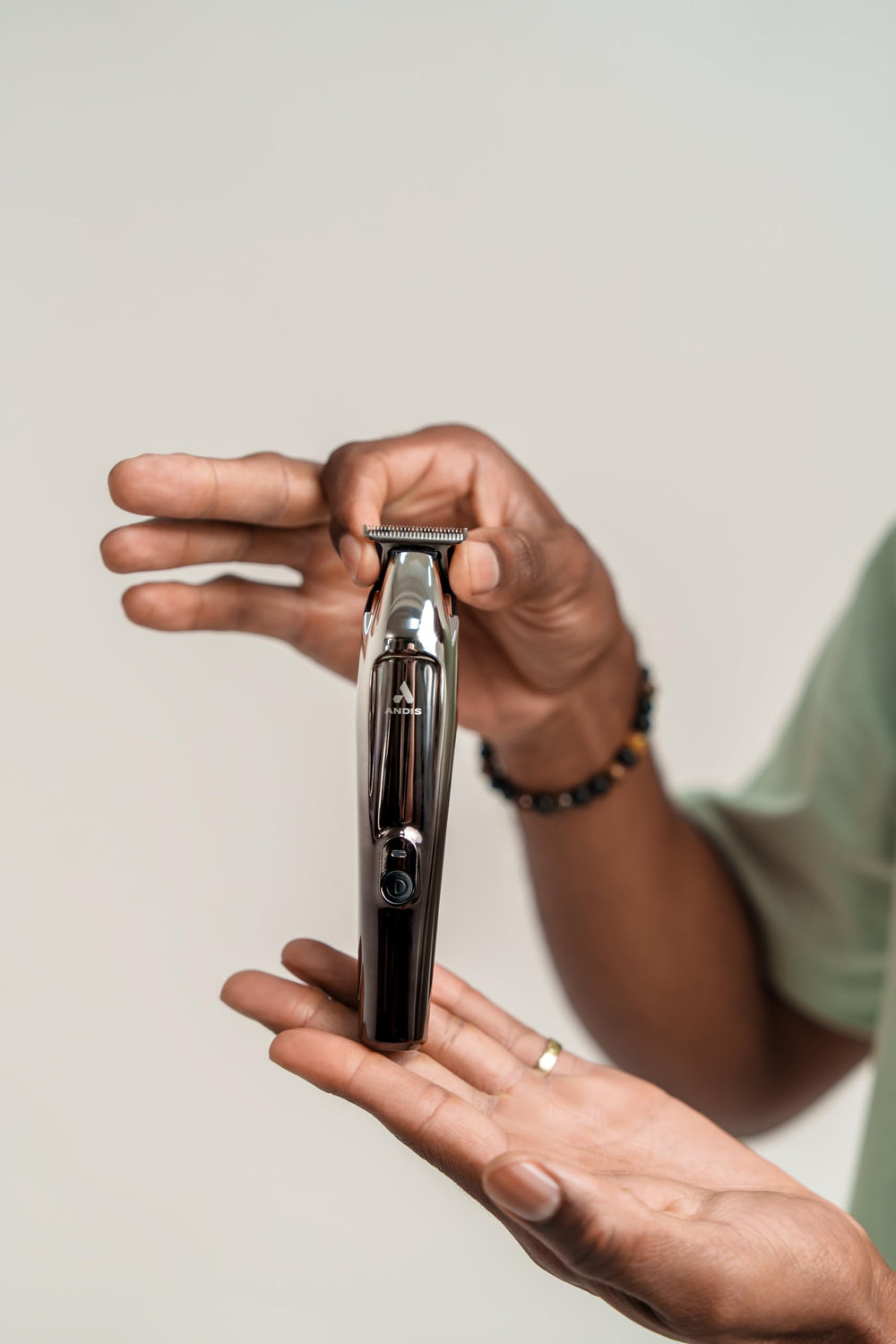 Andis Slimline Pro II in hand during beard trim for crisp lines.