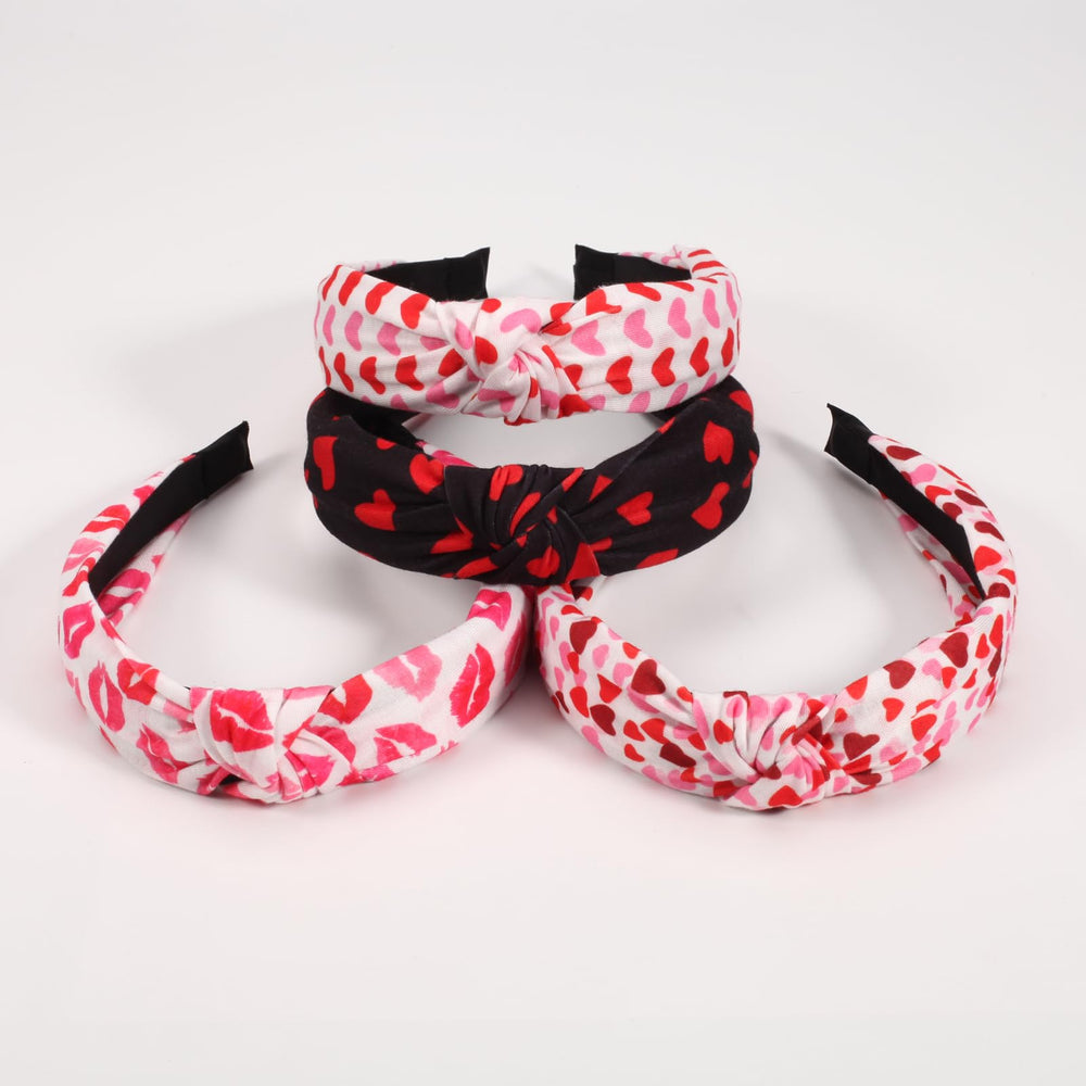 Ardorchid knot-detail headband adds a playful romantic touch.