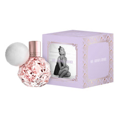 Ari by Ariana Grande bottle with plush white pom-pom signaling playful style