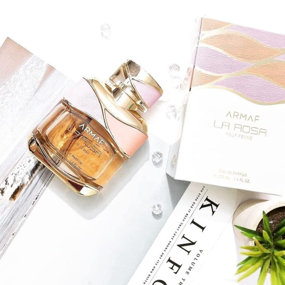 Armaf La Rosa Pour Femme spray bottle in action conveys fresh diffusion