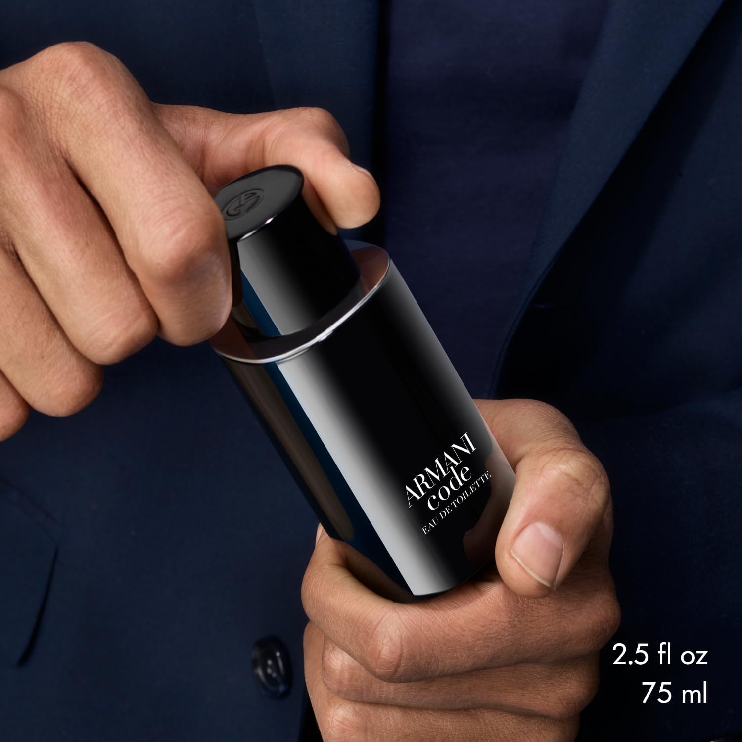 Armani Code application on wrists and neck demonstrates ideal spray target areas