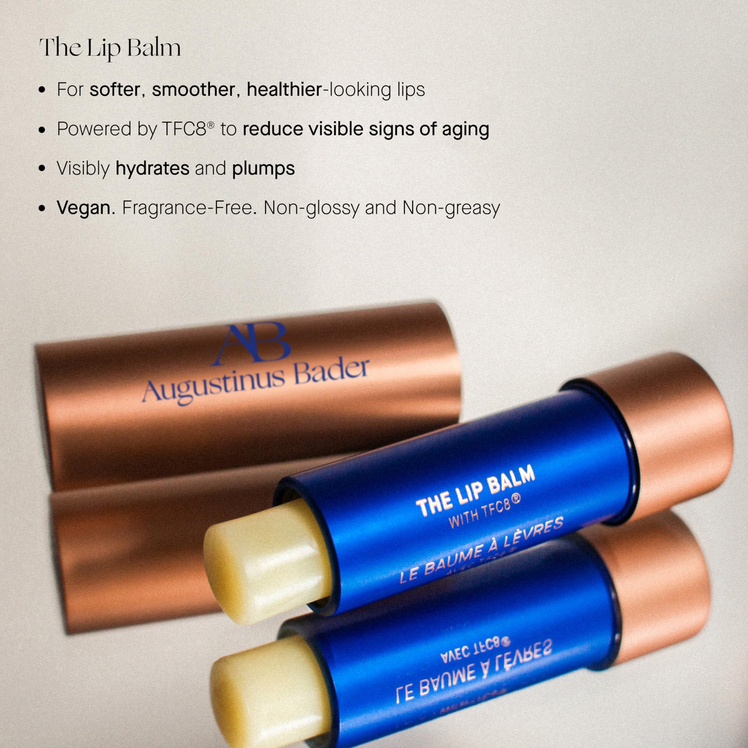 Application of Augustinus Bader Lip Balm for smooth, protective lip coverage.