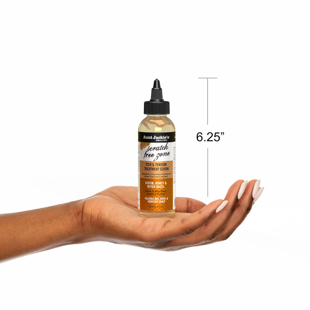 Aunt Jackie's serum on braided hairstyle for comfort.