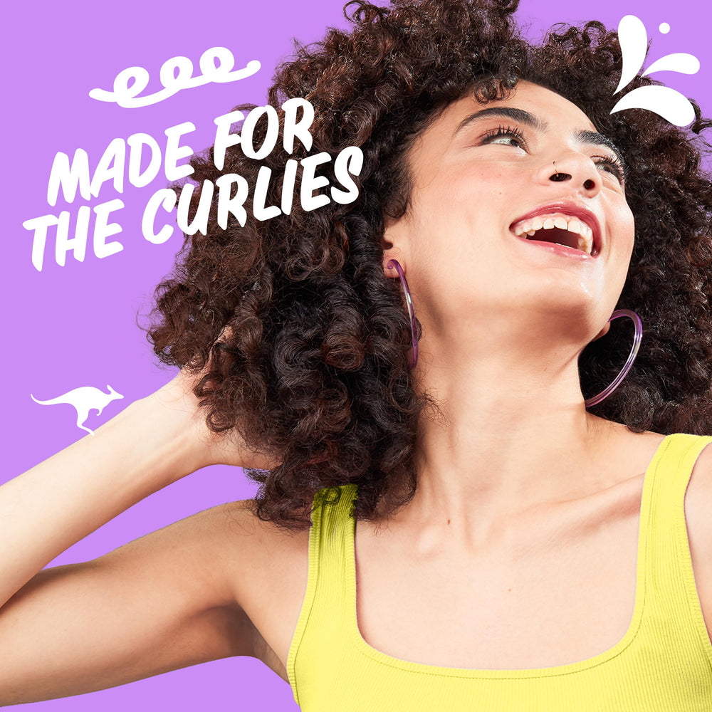 Aussie Miracle Curls detangling milk bottle easing knots for smoother combing