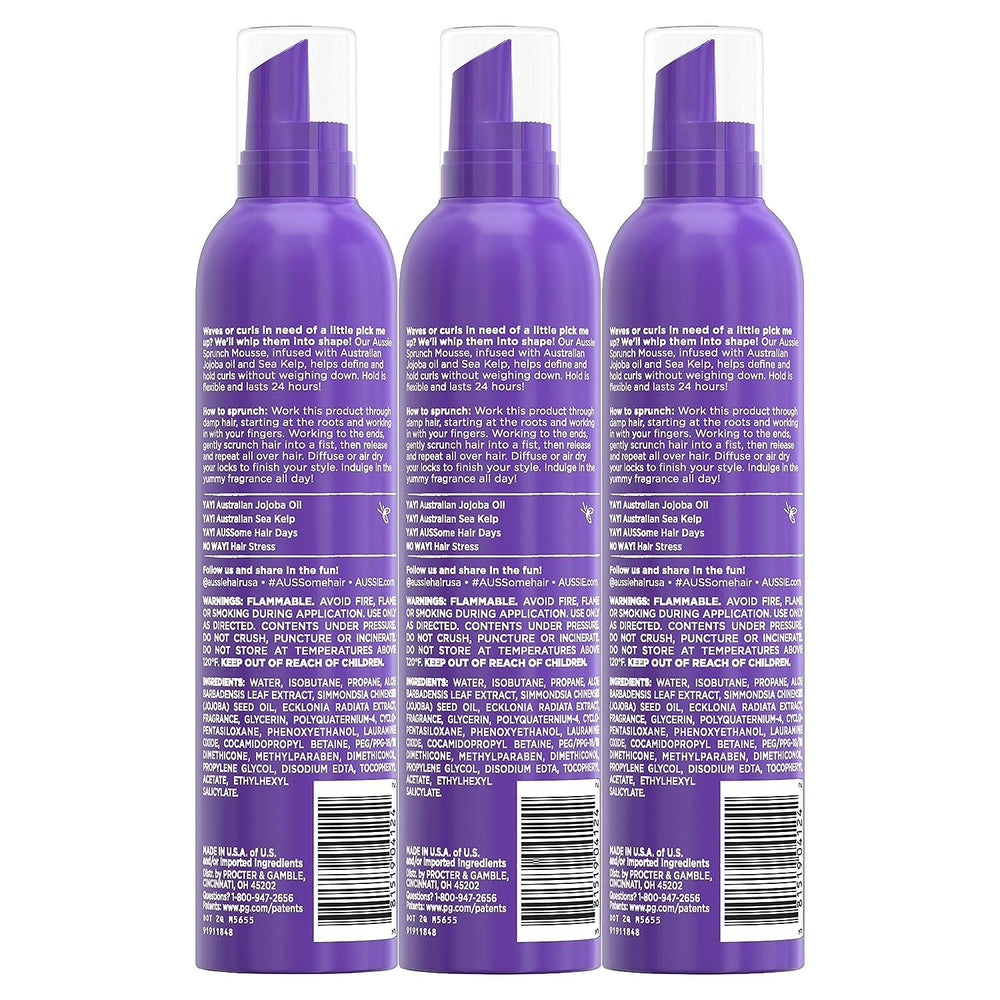 Hands applying Aussie Sprunch Mousse to damp curls for defined waves.