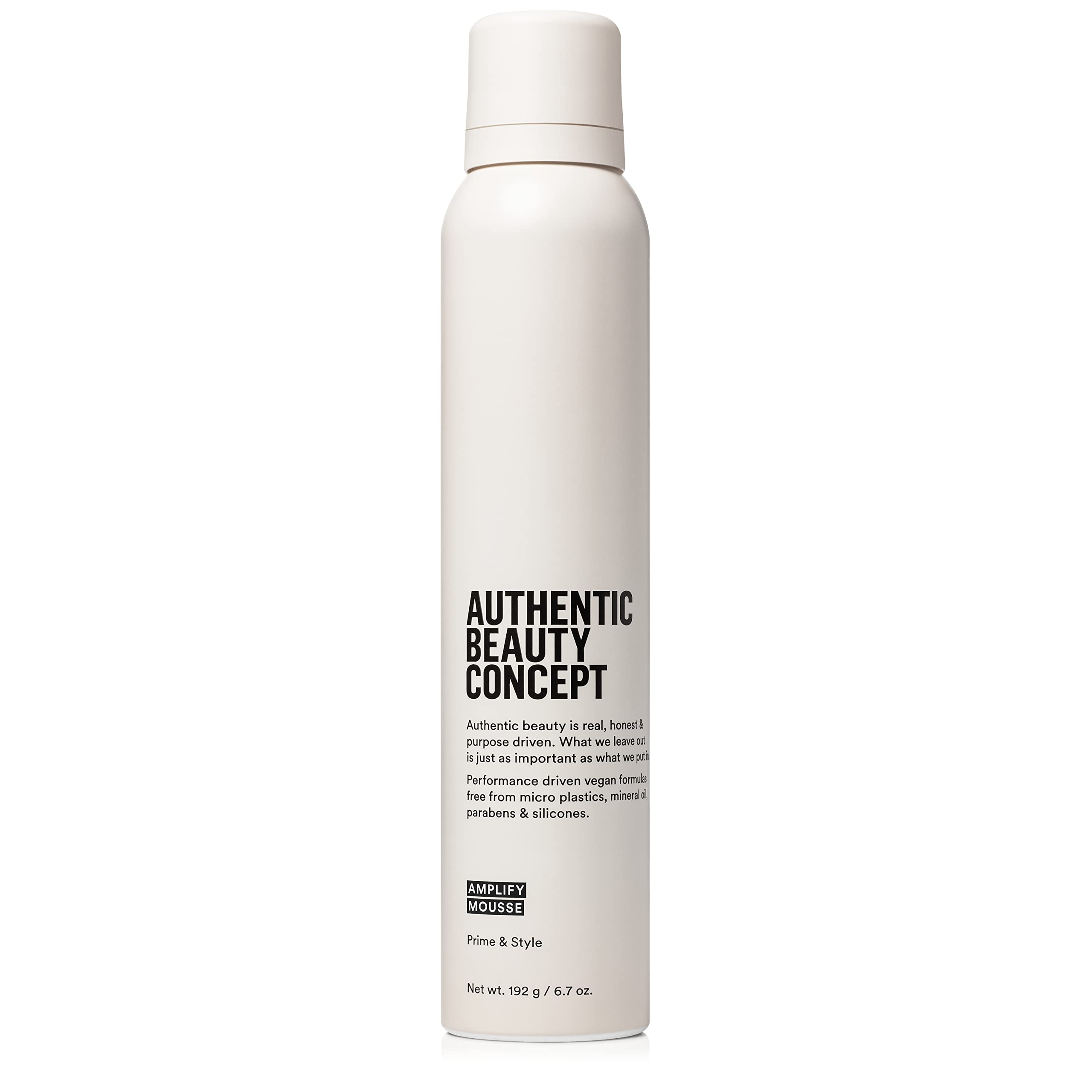 Authentic Beauty Concept Amplify Mousse bottle close-up showing lightweight volume.