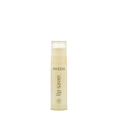 Bálsamo labial Aveda, envase elegante, ideal para hidratación diaria.
