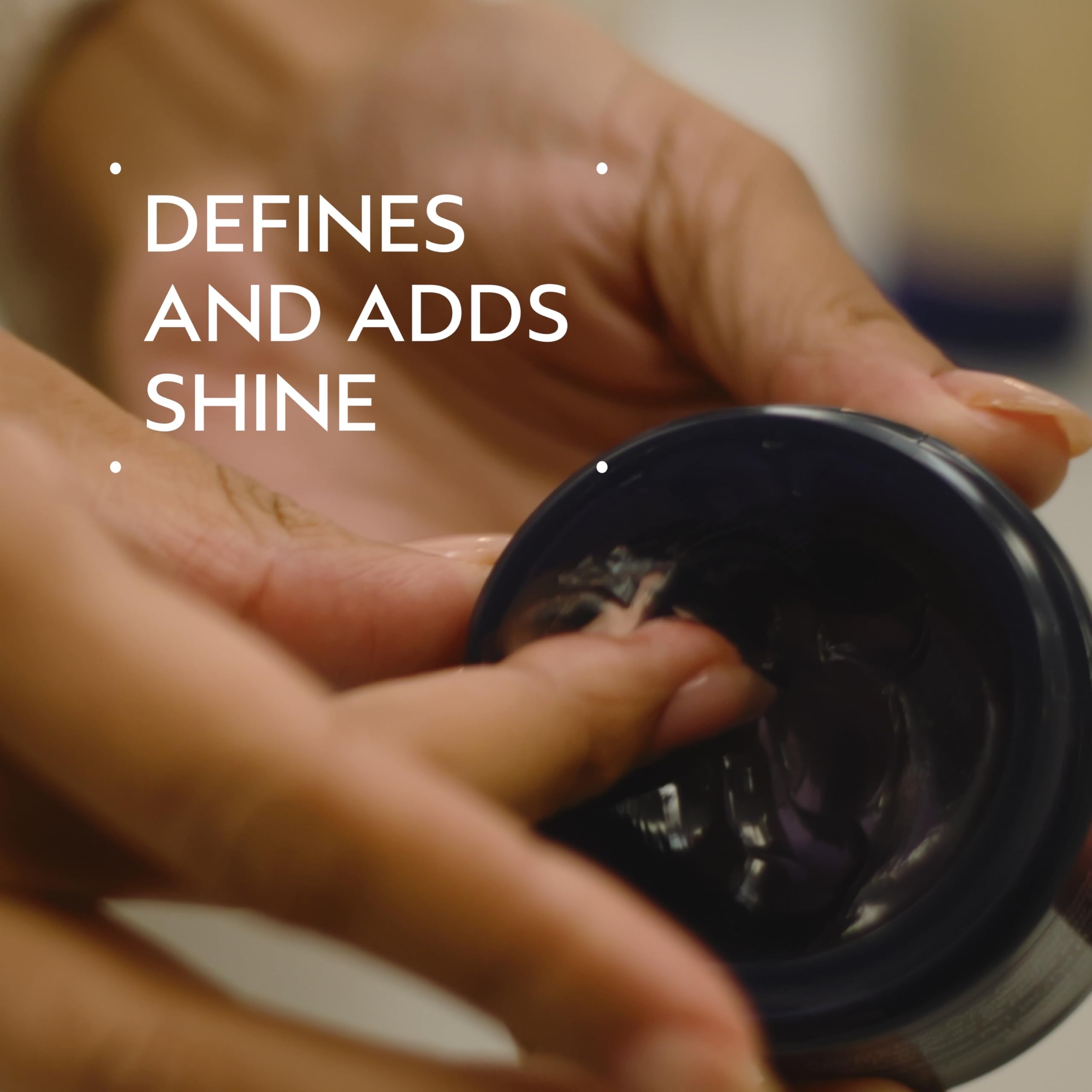 Aveda Humectant Pomade adds soft, glossy definition for wavy to coily hair.