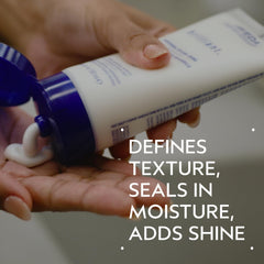 Aveda Brilliant Universal Styling Creme seals moisture for defined curls