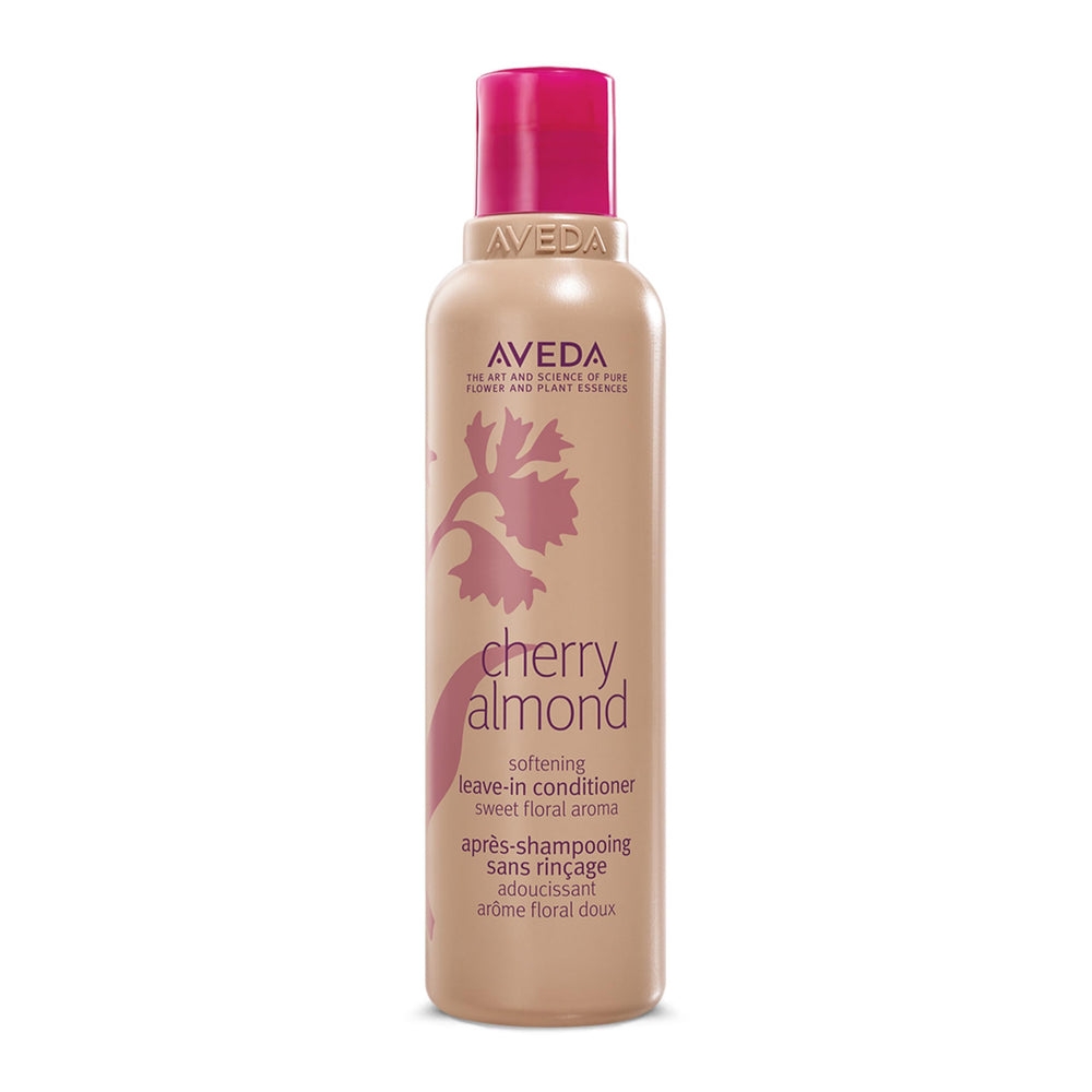 Aveda Cherry Almond Leave-In Conditioner bottle on a shelf for detangling.