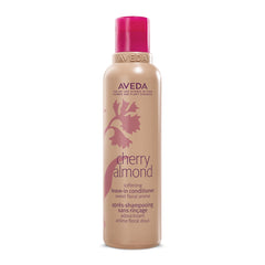 Aveda Cherry Almond Leave-In Conditioner bottle on a shelf for detangling.