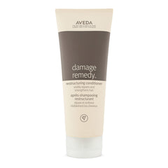 Aveda Damage Remedy bottle; promotes repair and strength for damaged hair.
