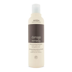 Aveda Damage Remedy shampoo bottle front shows repair and strengthening potential.