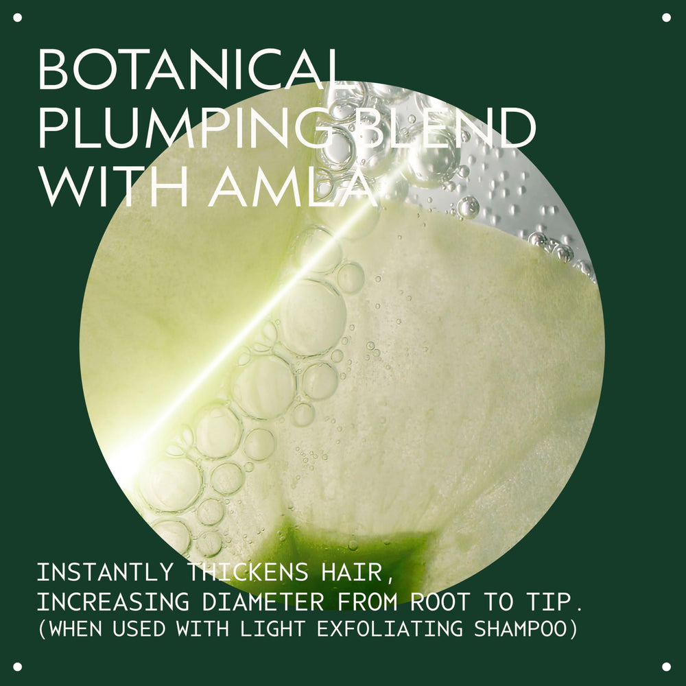 Aveda Invati Ultra Advanced Thickening Conditioner Light being applied to hair for enhanced fullness.