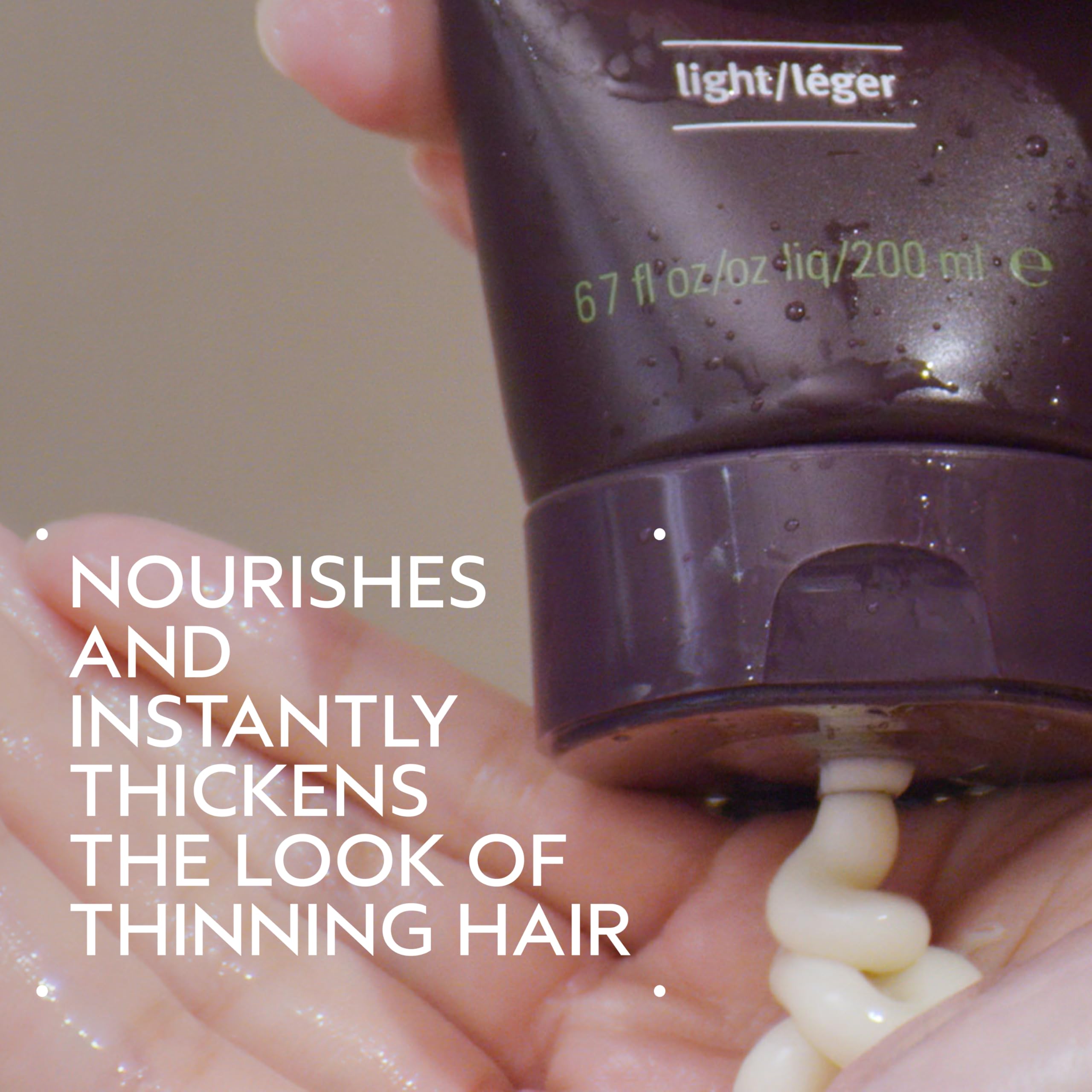 Close-up of Aveda Invati Ultra Advanced Thickening Conditioner Light texture for smooth detangling.