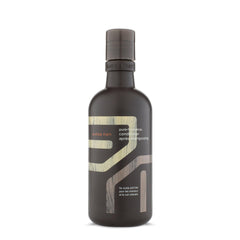 Aveda Men Pure-Formance Conditioner bottle pour for easy daily hair refresh and manageability.